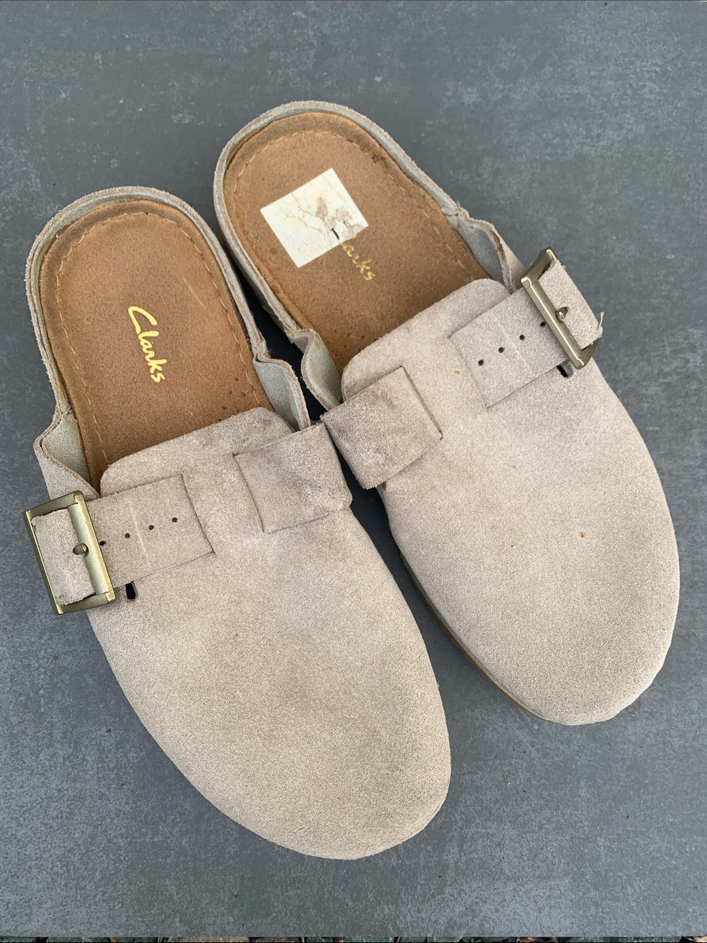 Clarks Womens Suede Slip-On Mules in Light Beige with Brass Buckles
